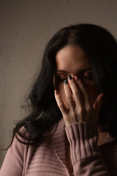 istock Nervous woman posing in the shadow 1307009867