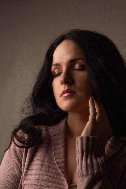 istock Sensual woman with closed eyes 1307009880