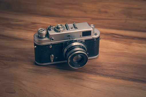 vintage camera on a wooden table background
