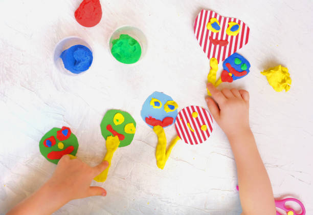 istock Child modeling fun craft . Modeling clay and paper crafts idea for kids. Activity in kindergarten and at home. 1307014622