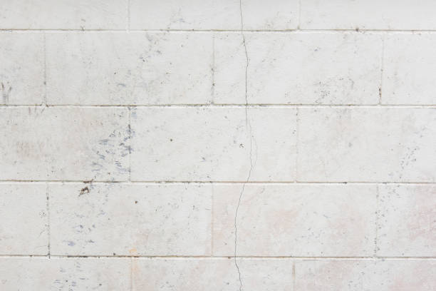 istock racked and marks on grungy plastered wall 1307017307
