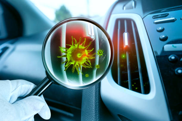 istock 3D simulation of viruses inside the Car ventilation system by showing through a magnifying glass. 1307018197