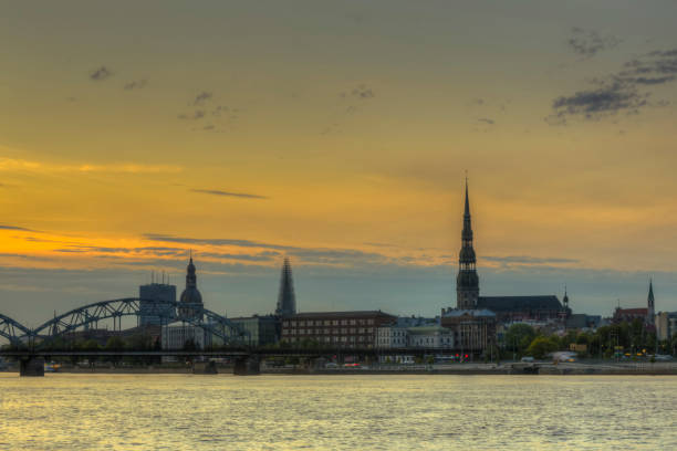 istock Night view on the illuminated riverside with reflection on the river in Riga 1307022561