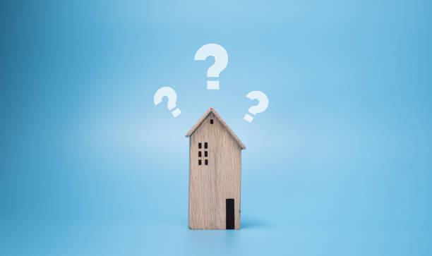 istock Question mark over wooden house on background. problem, information or FAQ 1307023594