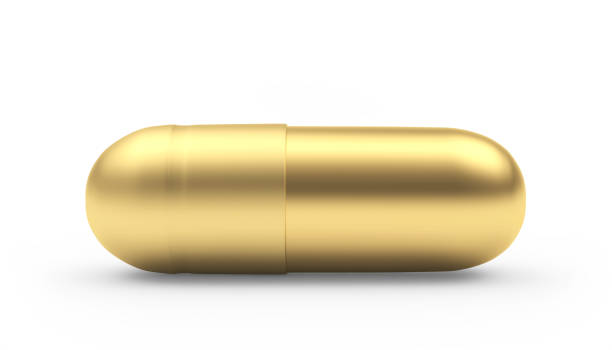 istock Golden medical capsule 1307023786