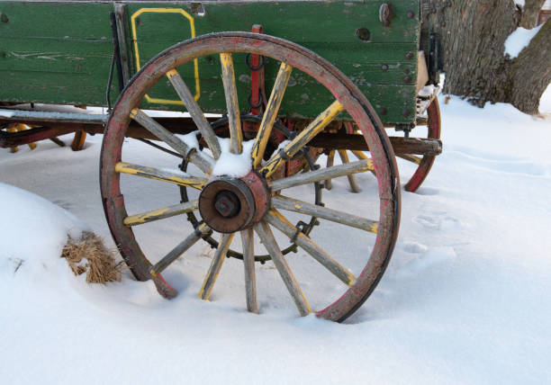 istock Old Wagon Wheel in the snow-Howard County, Indiana 1307024991