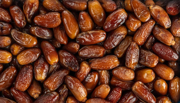 istock The surface texture of selected dried dates. 1307025485