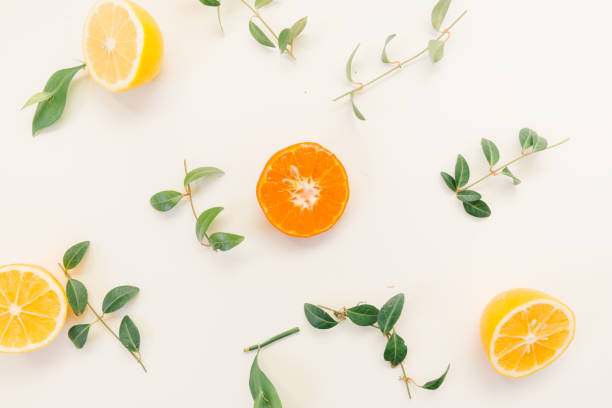 istock Fruit background. Colorful fresh fruits on white table. Orange, tangerine, lime, lemon, grapefruit. Flat lay, top view, copy space 1307025715