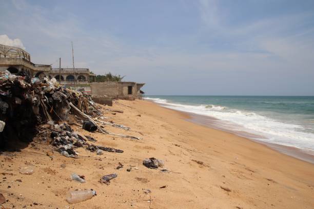 istock Garbage dump with plastic at the beach of Togo, West Africa. 1307026401