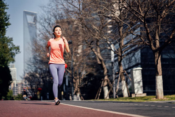 istock Female running in the city 1307026669