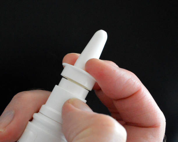 Treating hay fever with corticosteroids using nasal spray.