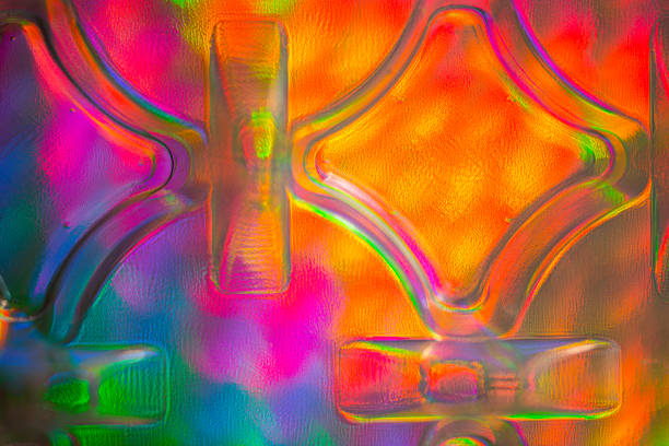 Abstract, blurred, vivid color background photographed through textured glass surface