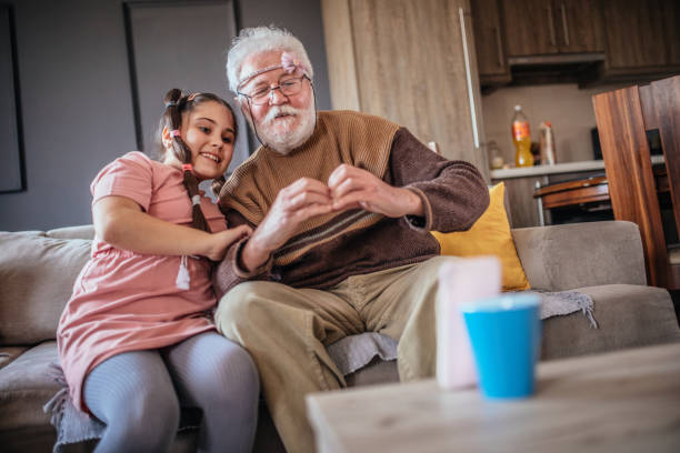 istock grandfather and child have a video call 1307029106