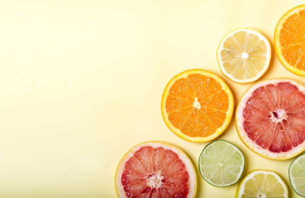 istock Many different citrus fruits on color background. 1307029515