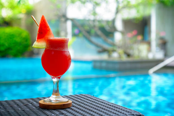 istock Watermelon juice view over swimming pool 1307030553