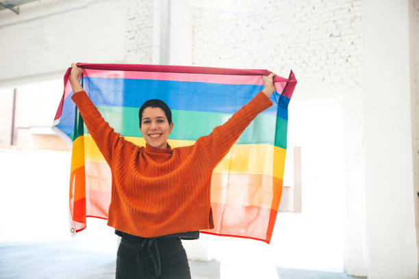 istock Woman stands for LGBTQIA rights 1307030685