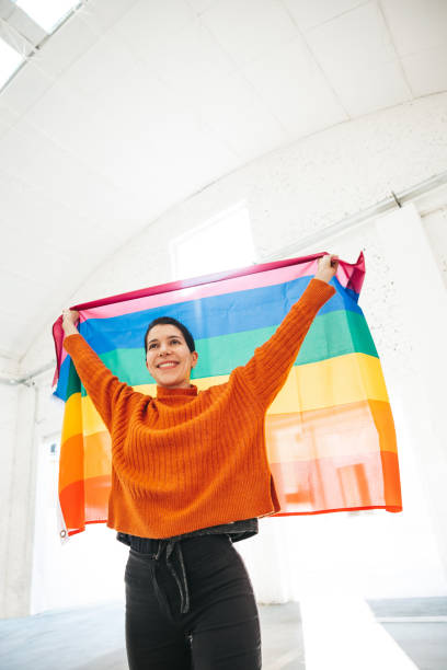 istock Woman stands for LGBTQIA rights 1307031465