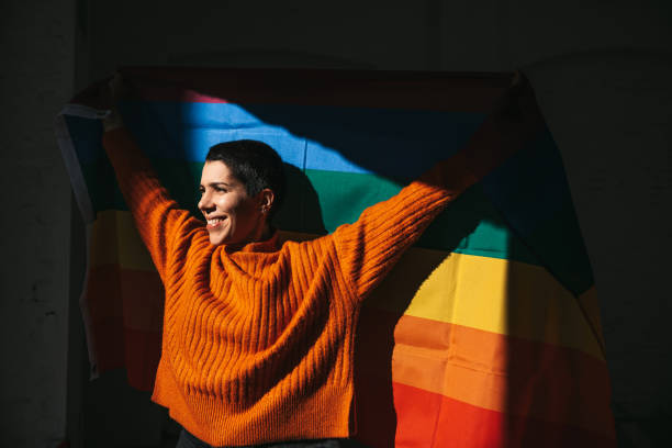 istock Woman stands for LGBTQIA rights 1307031866
