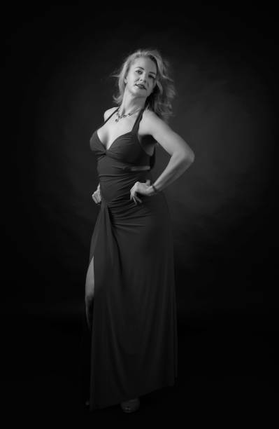 istock Attractive middle age woman in evening dress. 1307032116