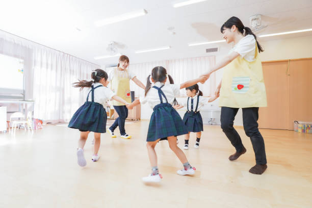 istock Kindergarten children and teachers dancing 1307033548