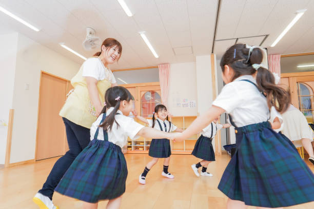 istock Kindergarten children and teachers dancing 1307033579