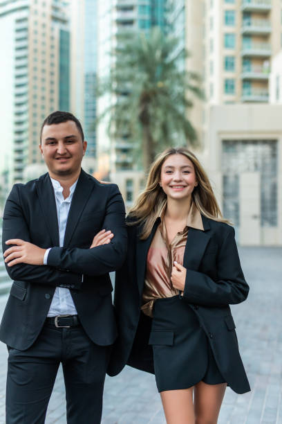 istock Successful business team standing outside office building 1307034608