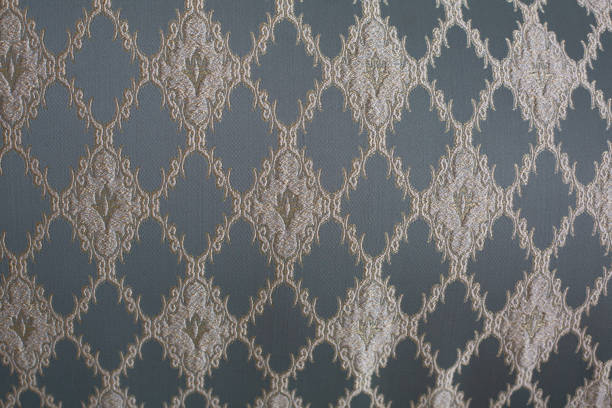 istock Closeup shot of vintage couch with a blue and gold pattern 1307035073