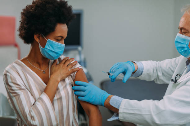istock African american woman getting a vaccine 1307036355