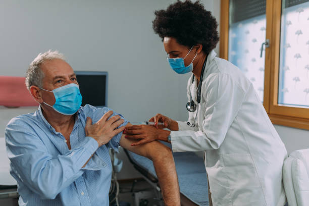 istock Patient getting a vaccine in hospital 1307036375