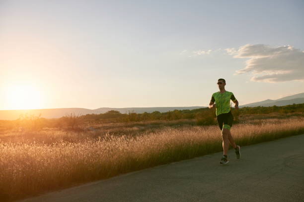 istock triathlon athlete running on morning trainig 1307036504