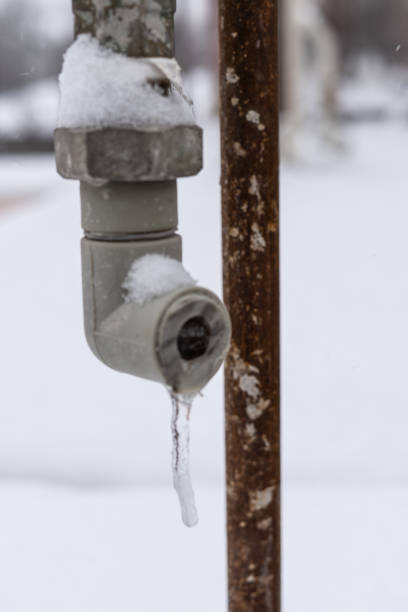 istock Icicle hanging from tap in early spring, winter 1307037207