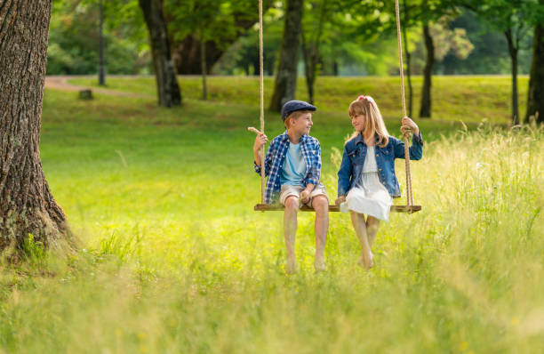 istock Two Best Friends On A Swing 1307037911