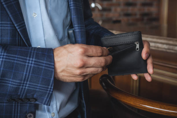 istock Men hand wallet in the pocket 1307038575