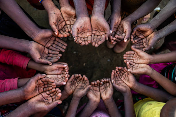 istock Hands of poor - asking for help, Africa 1307038878