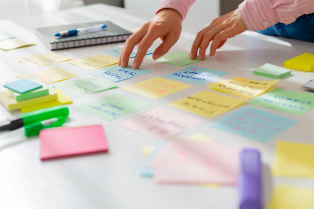 istock Business people work in the office with sticky notes. Brainstorming concept. 1307042790