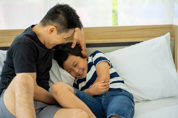 istock Asian father business man work from home playing with son boy on ned 1307045539