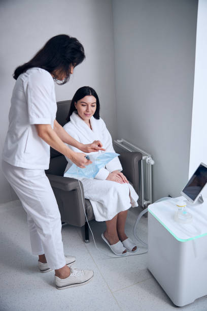 istock Physician telling about a medical procedure to a smiling patient 1307049938