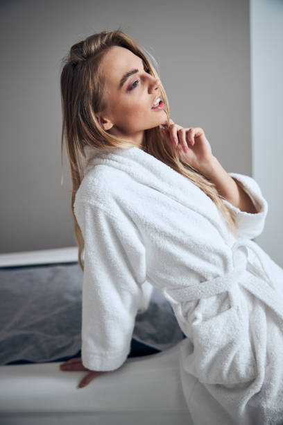 istock Spa client lost in reverie before a beauty treatment 1307049955