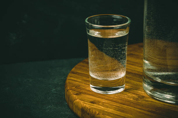 istock Stemware of water on wooden table. 1307050726