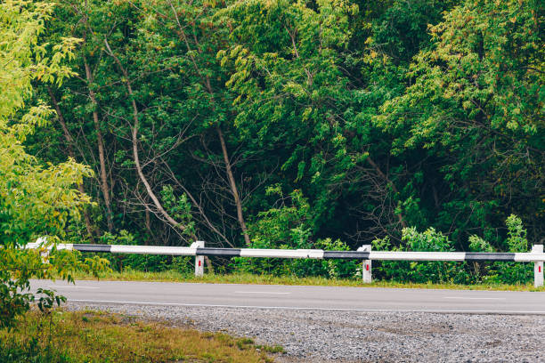 istock Dry asphalt road with barrier fence 1307050826