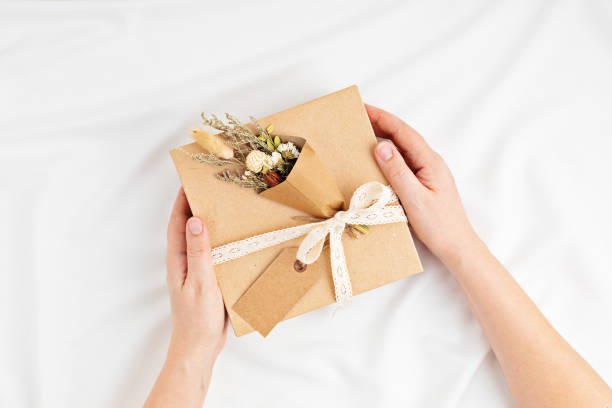 istock Gift boxes in craft paper and natural decorations, creative and recyclable holidays present wrapping 1307052112