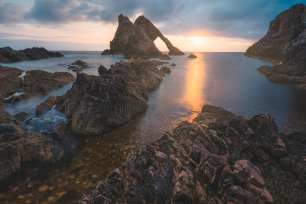 istock Bow Fiddle Rock, Scotland 1307052245