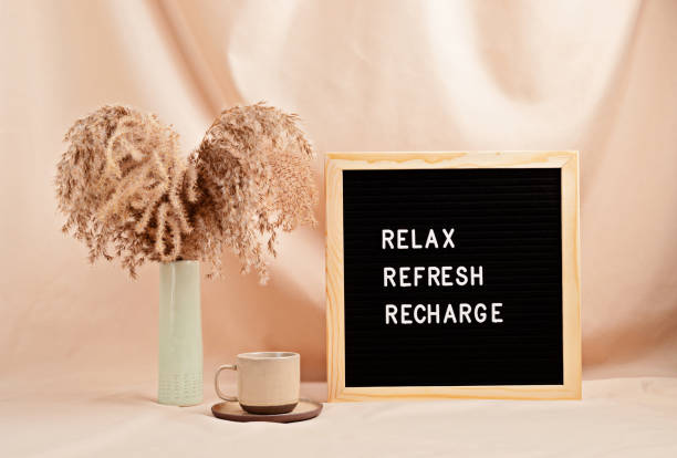 istock Relax, refresh, recharge, motivational quote on letter board 1307052248