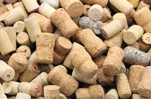 Abstract background with wine corks from sparkling, corks from white wine, corks from red wine and other wine corks