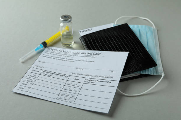 istock Concept of Covid - 19 vaccination on gray background 1307053740