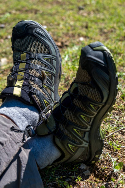 istock Walking shoes lying on the grass in close-up 1307053752