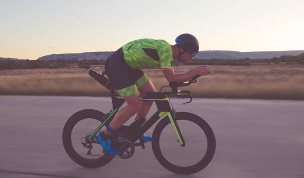 istock triathlon athlete riding a bike 1307053976