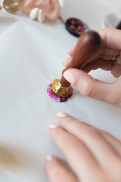 istock Handmade card with sealing wax in the process 1307055249