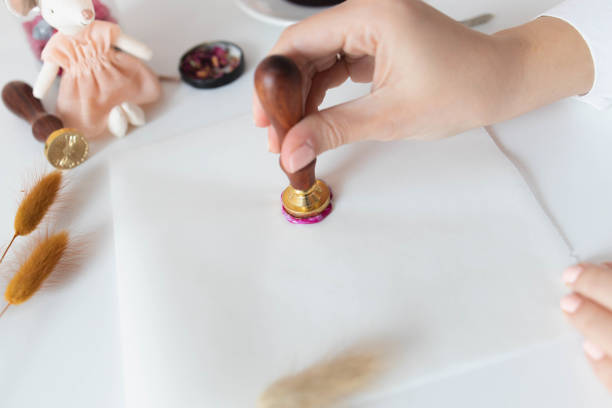 istock Handmade card with sealing wax in the process 1307055252