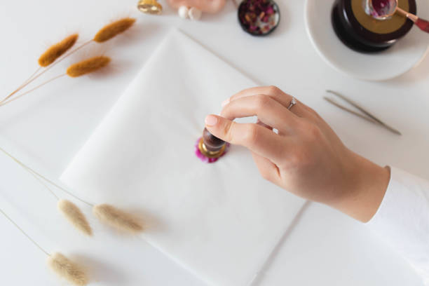 istock Handmade card with sealing wax in the process 1307055254